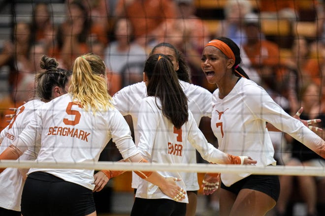 Texas players celebrate a point during Thursday night's four-set win over Houston at Gregory Gym. The Cougars won the opening set before the nation's No. 1 team responded by winning the next three.