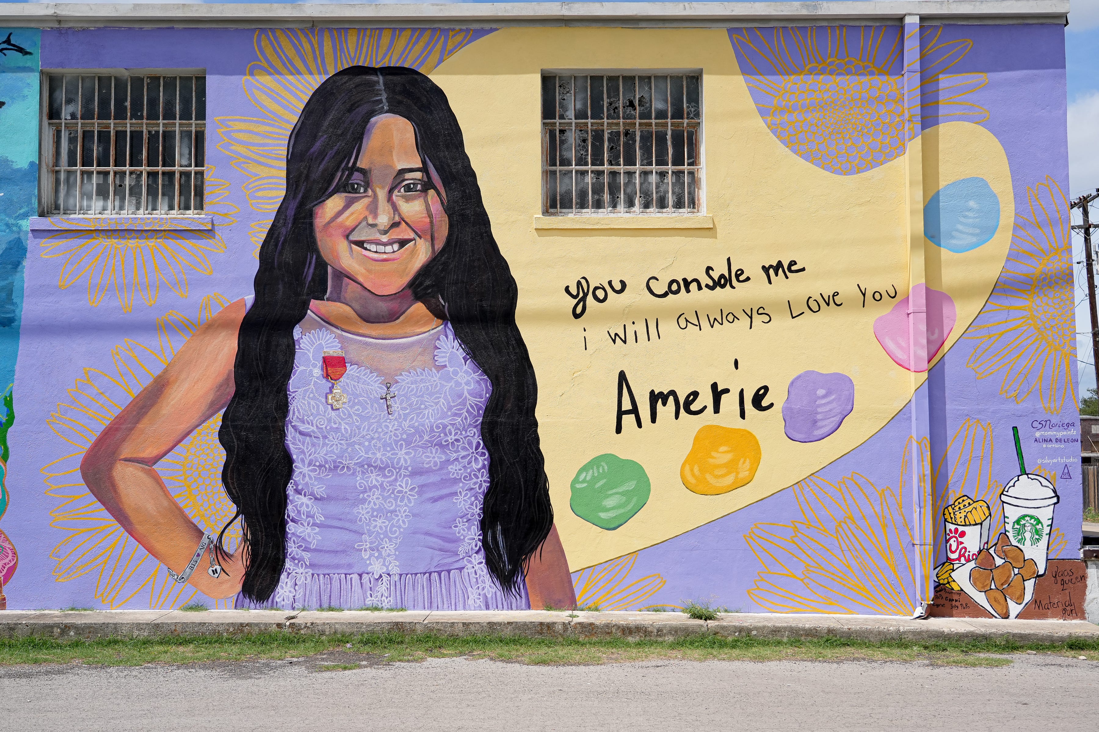Amerie Jo Garza stands proudly at the St. Henry de Osso building, 114 E. Nopal St. in Uvalde, in her purple dress sporting a bronze cross, an award given to a Girl Scout who has shown extraordinary heroism or risked her life to save another's.