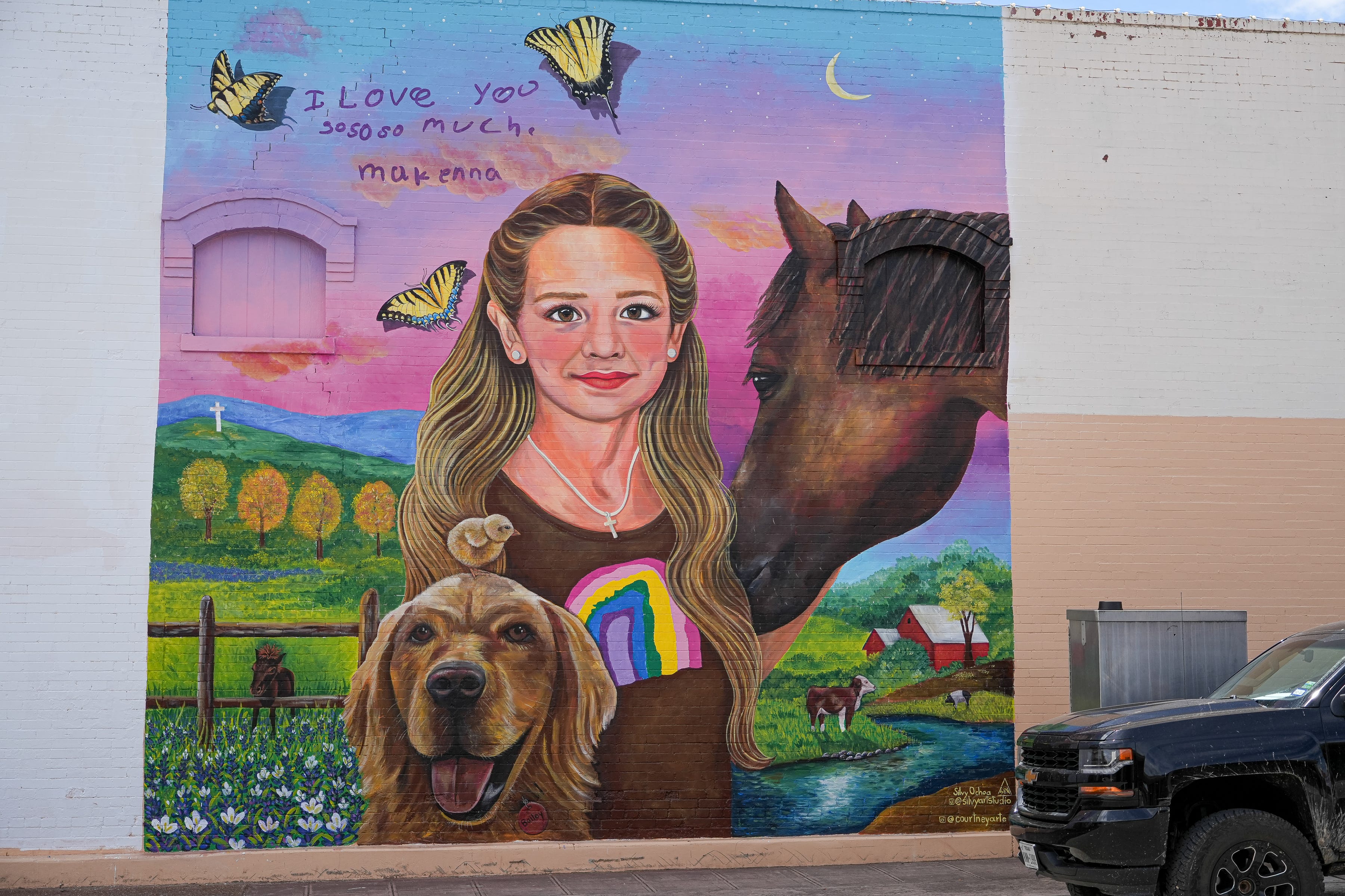 Makenna Elrod is painted with her animals, including the chicken she was raising and her golden retriever Bailey, on the wall of Amy's Attic, 116 N. Getty St. in Uvalde.