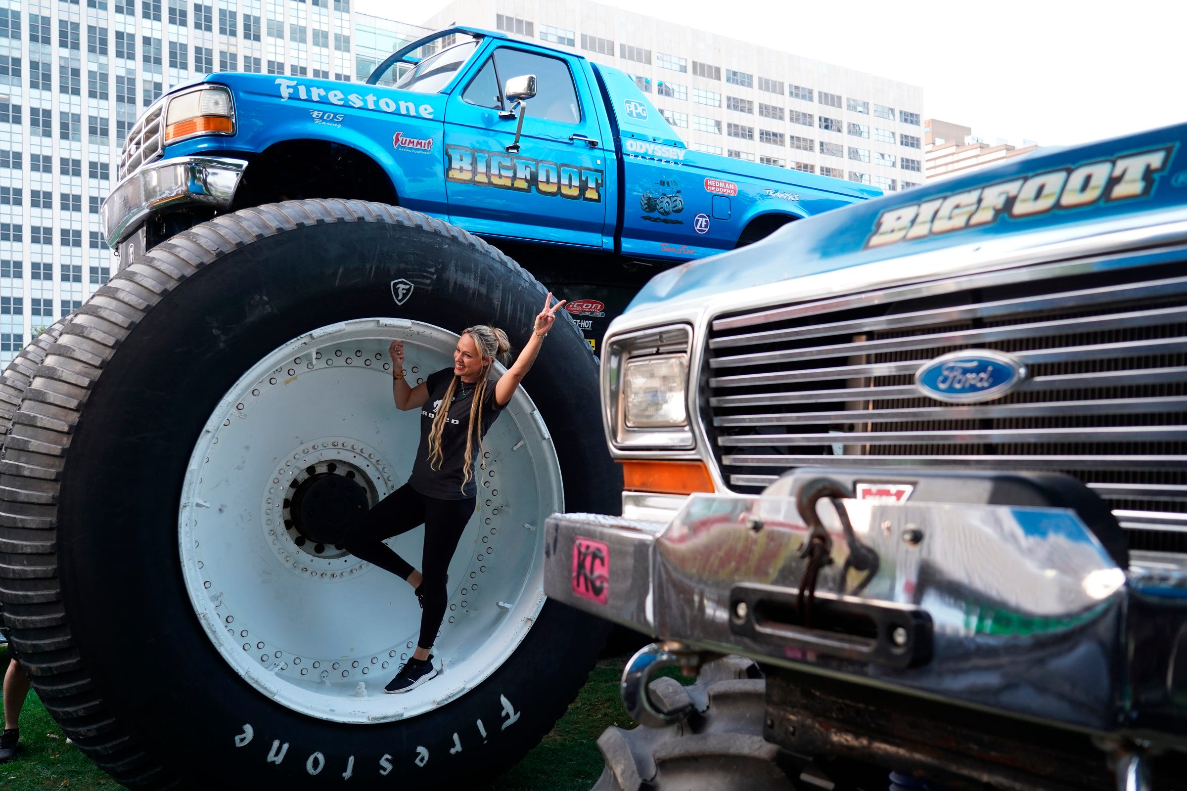 Yolo Freeman of Montezuma, Iowa, stands inside a tire of Bigfoot truck during the Ford pre-show event as part of the 2022 North American International Auto Show held at Hart Plaza in downtown Detroit on Wednesday, Sept. 14, 2022.