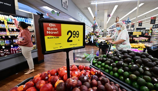 People shop at a grocery supermarket in Alhambra, California, on July 13, 2022.