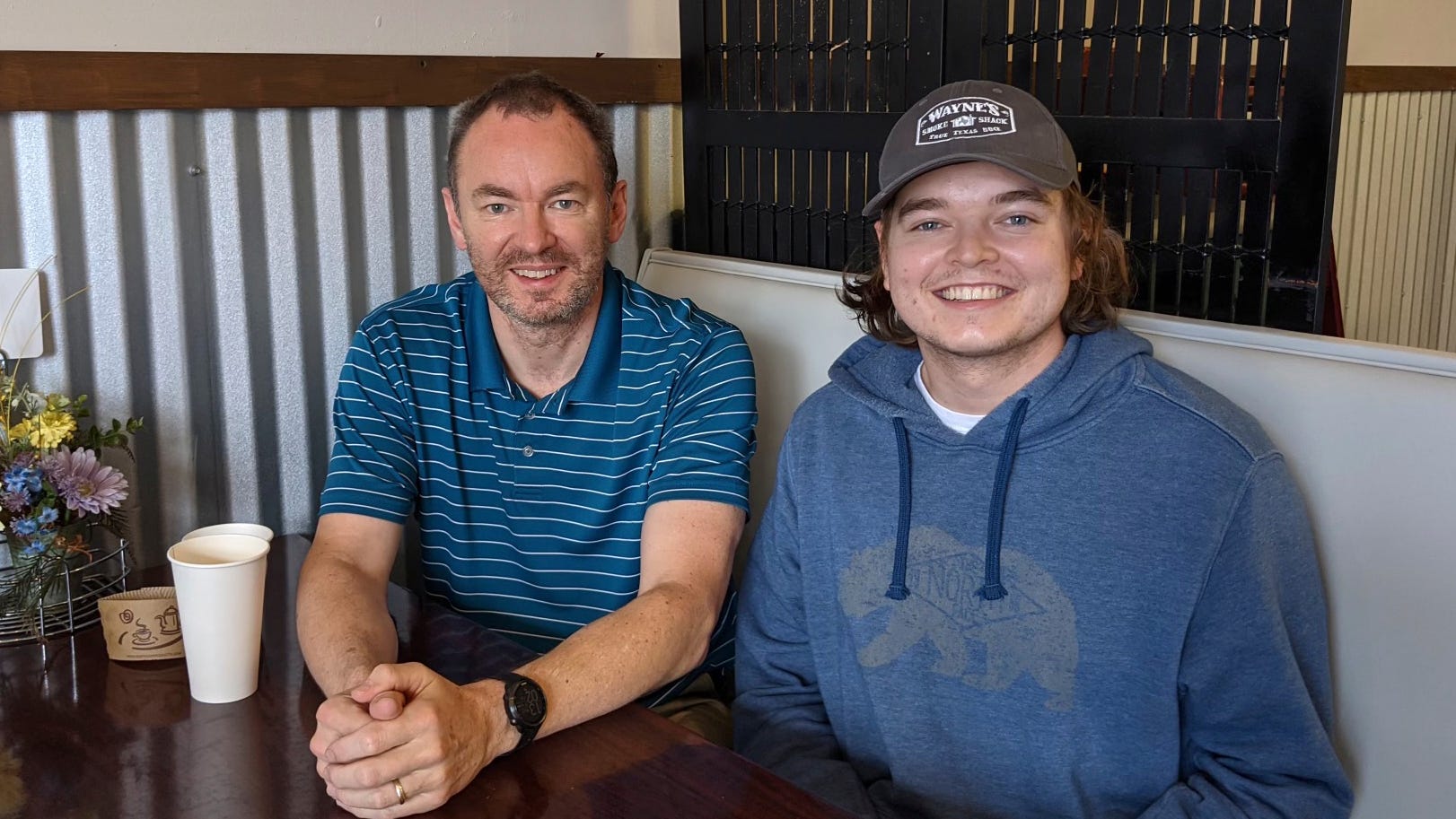 Christian Glass, right, sits with his father, Simon Glass, in Colorado on March 11, 2021. Family members are asking for accountability in the death of Christian Glass, a 22-year-old Colorado man who was shot by police earlier this year after calling 911 for roadside assistance. Christian Glass's parents believed officers escalated a situation that could have been handled differently, and hope the district attorney will bring criminal charges.