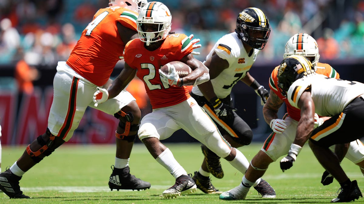 Miami running back Henry Parrish Jr. (21) runs the ball against Southern Mississippi during the second half at Hard Rock Stadium.