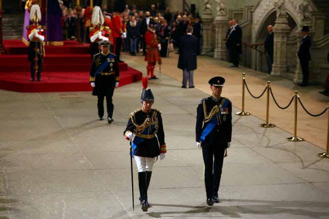 Princess Anne, in the foreground, and Prince Andrew and Prince Edward leave after attending a vigil for Queen Elizabeth II while on state at Westminster Hall in London, September 16, 2022.