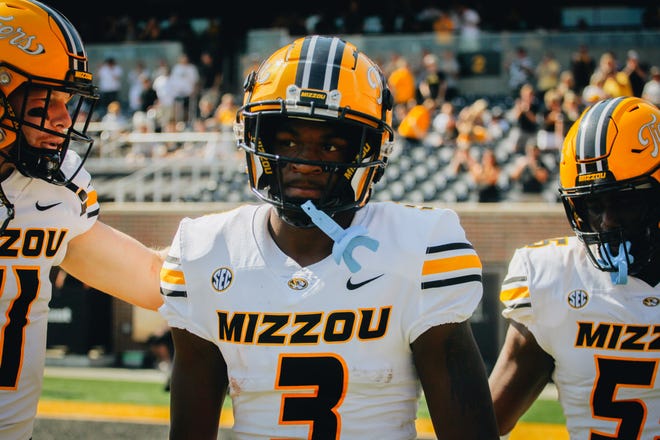 Missouri freshman Luther Burden is hyped up by his teammates after scoring the first touchdown of the game during a game against Abilene Christian on Saturday at Faurot Field.