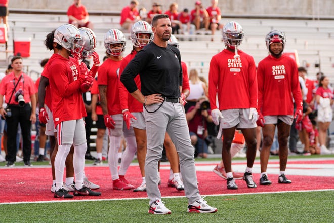 Sep 17, 2022; Columbus, Ohio, USA; Ohio State Buckeyes passing game coordinator Brian Hartline watches his wide receivers warm up prior to the NCAA Division I football game against the Toledo Rockets at Ohio Stadium. Mandatory Credit: Adam Cairns-The Columbus Dispatch