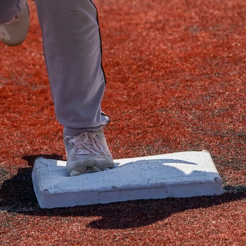 Larger bases are installed on the infield during a