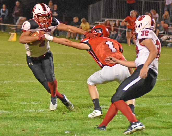 Litchfield playmaker Miguel Pedroza (1) makes a Tekonsha tackler miss Friday night in 8-man play