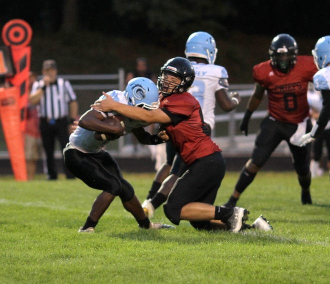 Josh Bambrick makes a tackle for loss for White Pigeon in the Chiefs' 62-8 win over Comstock on Friday night.