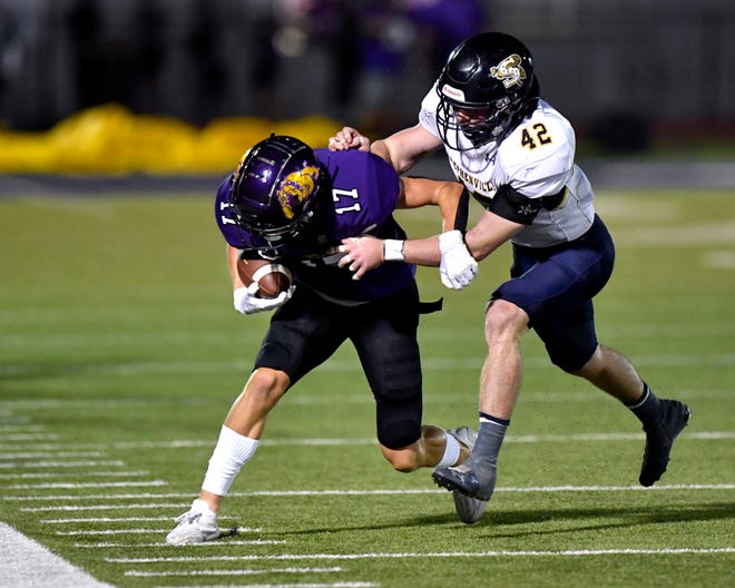 Stephenville linebacker Rowdy Markland forces Wylie wide receiver Kenny Scott out of bounds during Friday's game at Bulldog Stadium in Abilene against Stephenville. Final score was 56-49, Stephenville.