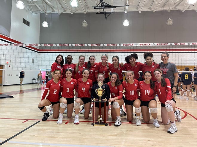 The North Fort Myers volleyball team poses for pictures following their championship win over Naples at the Wolfpack Invitational on Sept.  17, 2022.