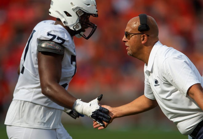 Penn State Nittany Lions head coach James Franklin with  offensive lineman Sal Wormley (77) as the Auburn Tigers take on the Penn State Nittany Lions at Jordan-Hare Stadium in Auburn, Ala., on Saturday, Sept. 17, 2022.
