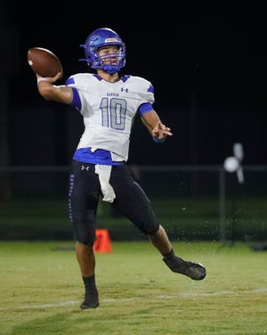 Barron Collier quarterback Thomas Mooncotch throws a pass for a completion agains Bonita.  The Bonita Springs Bullsharks hosted the Barron Collier Cougars Friday, September 16, 2022 in a high school football matchup.