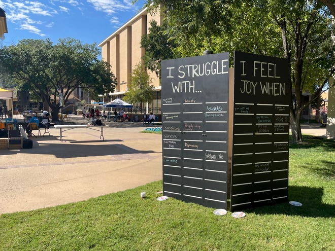 Colorful chalk surrounded a chalkboard at the Garden of the Mind event Saturday. The board allowed attendees to write their feelings for others to see, so people know they're not alone.