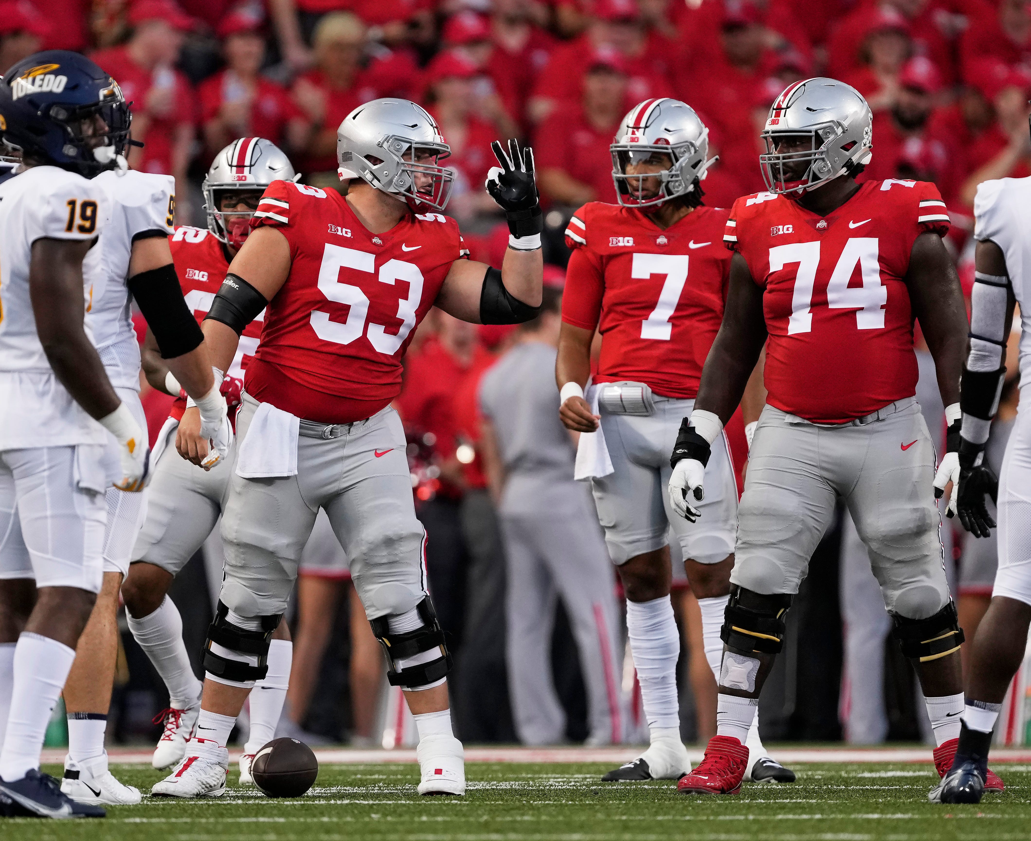 Ohio State Buckeyes center Luke Wypler calls out a protection to guard Donovan Jackson last week against Toledo.