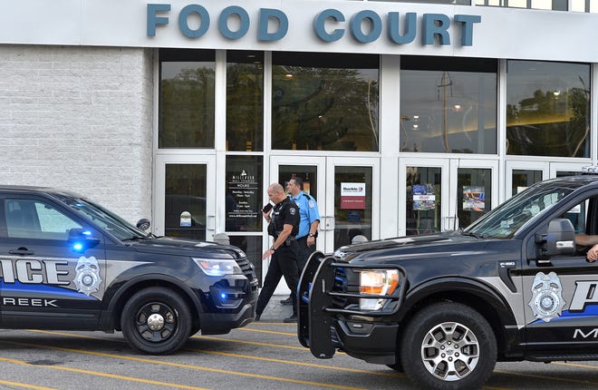 Millcreek Police Lt. Scott Sebulak, at center, on phone, said no one was shot, but that a shooting occurred, on Sept. 18, 2022, around 4 p.m. near the food court area at the Millcreek Mall in Millcreek Township. 