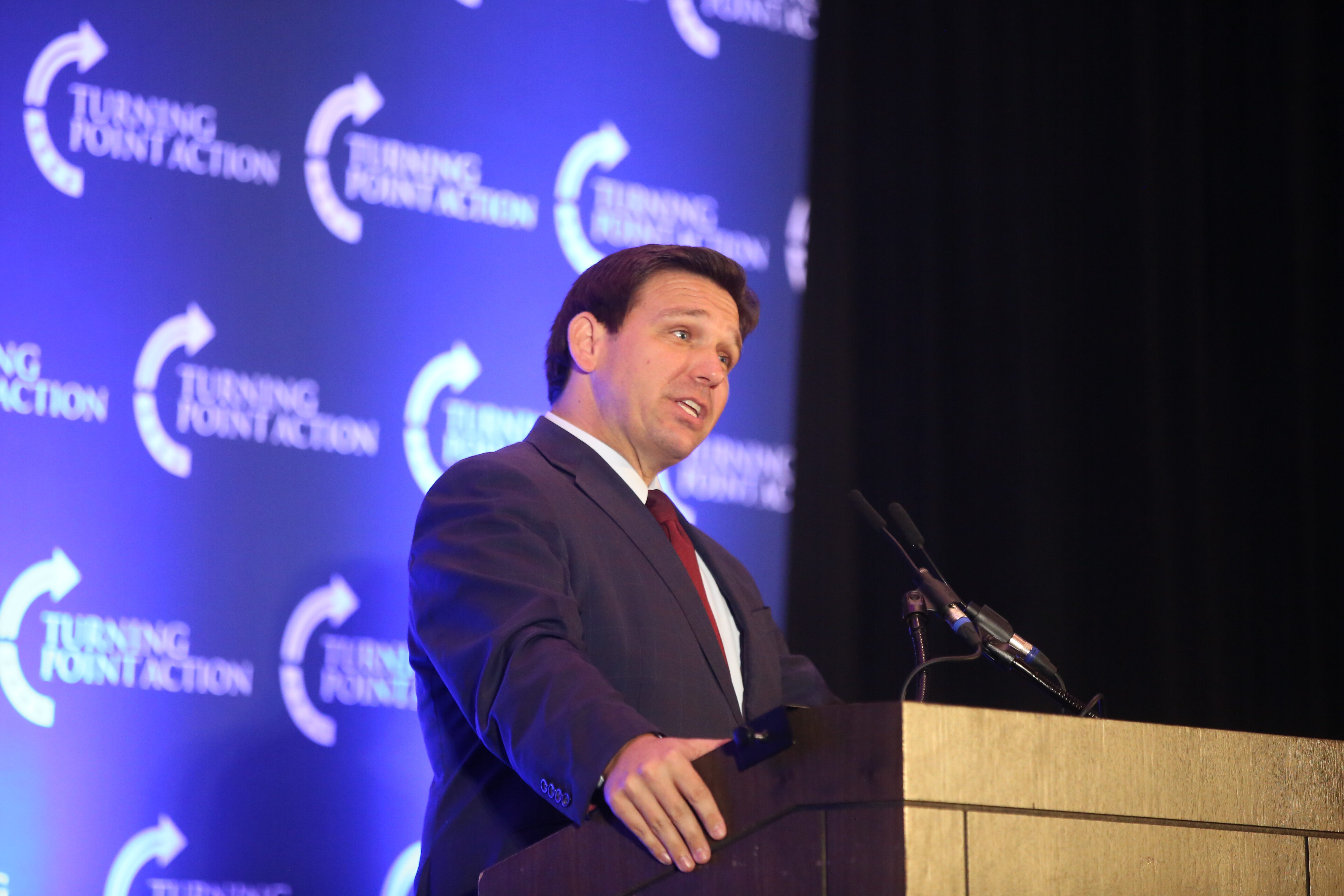 Florida Gov. Ron DeSantis speaks Sunday at a rally for Attorney General Derek Schmidt's gubernatorial campaign in Olathe.