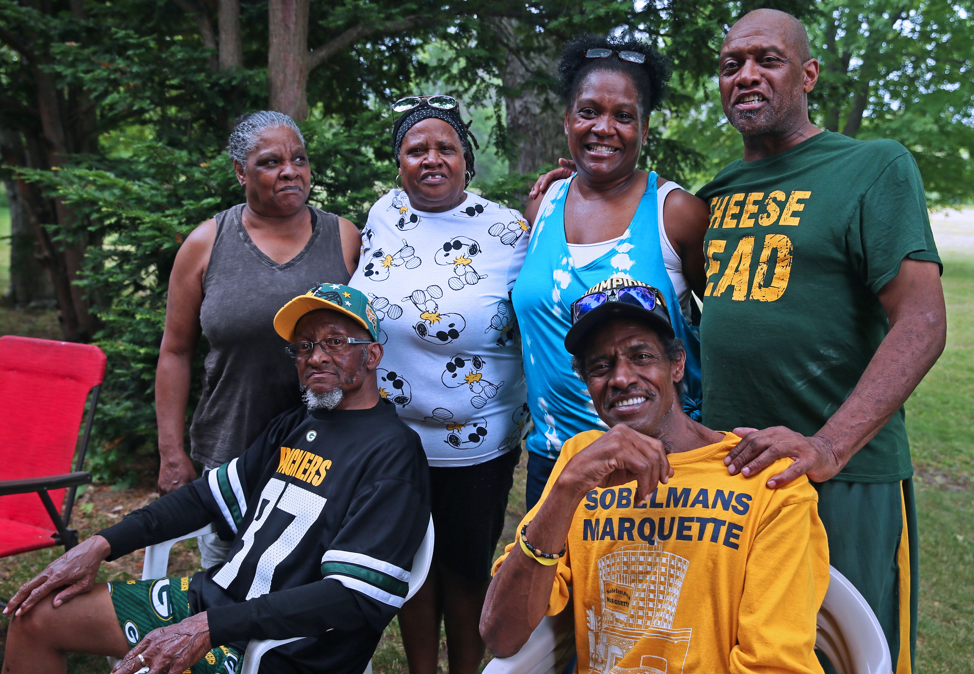 Elijah Edwards' family, from left, standing, Mae Kirby, (sister), Viola Edwards (sister), Kathy Conley (blue, niece) and older brother Larry Edwards (green packers t-shirt), seated,  Albert Edwards (brother), left, and Elijah Edwards, right.