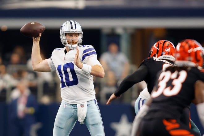 Dallas Cowboys quarterback Cooper Rush (10) throws a pass in the second quarter against the Cincinnati Bengals at AT&T Stadium.