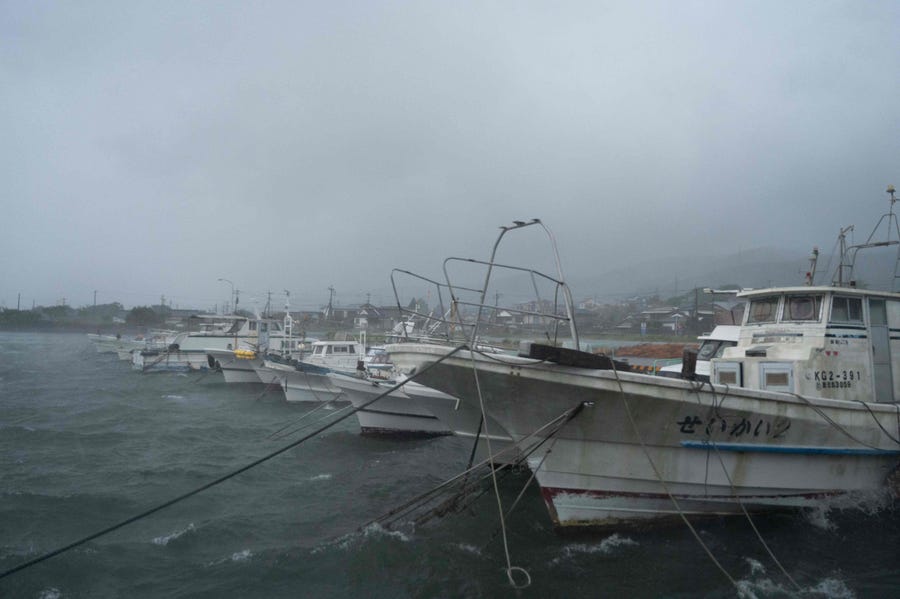 This picture shows moored boats amid strong rain as Typhoon Nanmadol approaches Izumi, Kagoshima prefecture on September 18, 2022.