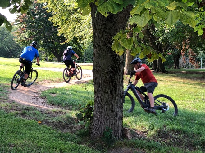 Mountain bikers ride the new Lakeview Trail on the Whirlpool Corp. campus on Sept. 15, 2022, in Benton Charter Township.