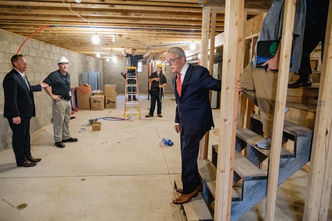 Gov. Mike DeWine meets Monday with Buckeye Career Center students who are building a house near the school in New Philadelphia.