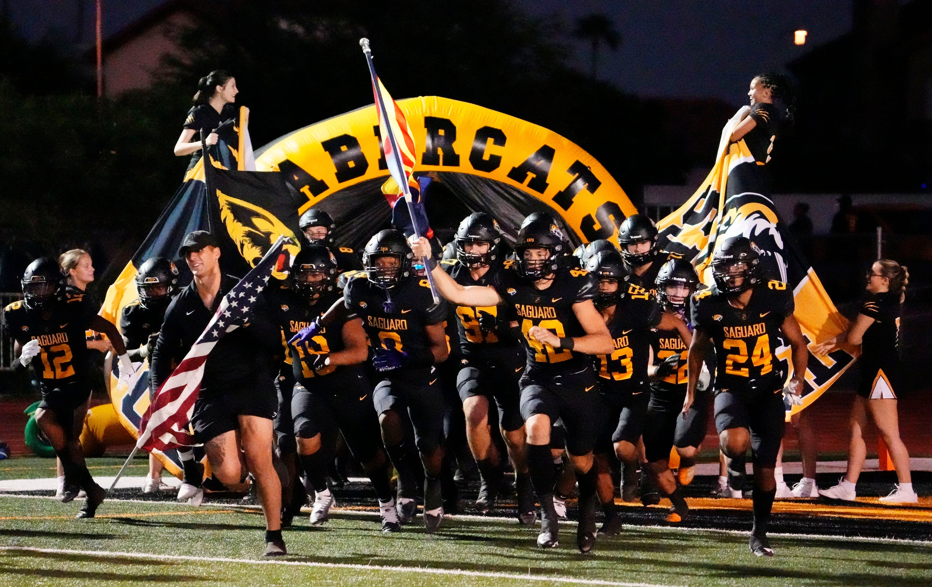 Saguaro Sabercats take the field to play the Sandra Day O'Connor Eagles during a game played at Saguaro High School in Scottsdale on Sept. 16, 2022.