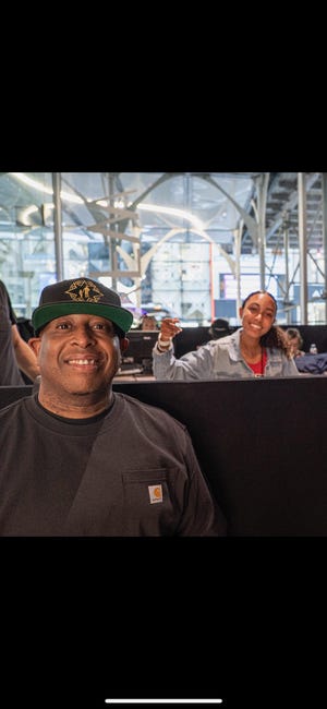 DJ Premier takes a photo with Sophia Clayton, 14, of Dover, who is better known as DJ Sophia Rocks, at New York Fashion Week in New York City on Sept. 8, 2022.