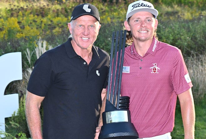 LIV Golf CEO Greg Norman, left, poses with Cameron Smith, the winner of the Invitational Chicago LIV Golf tournament at Rich Harvest Farms.