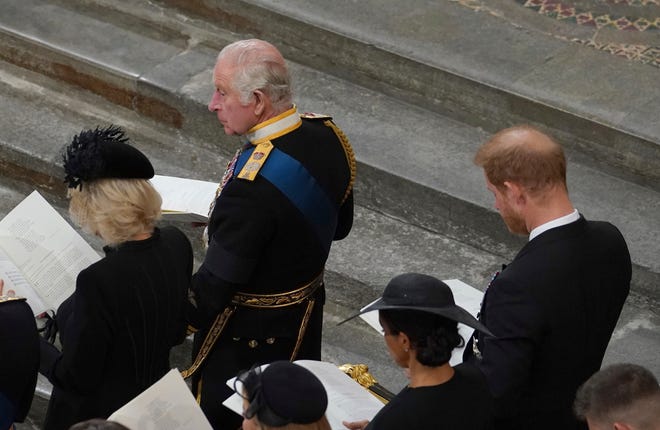 King Charles III and Camilla, the Queen Consort in front of Prince Harry and Meghan, Duchess of Sussex at the State Funeral of Queen Elizabeth II, held at Westminster Abbey, London, Monday, Sept. 19, 2022.