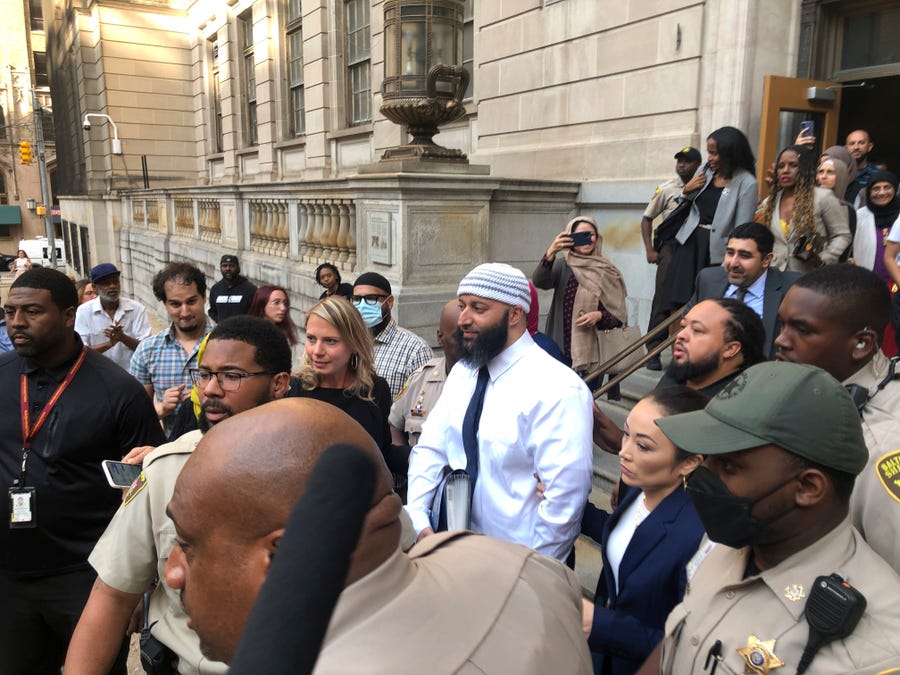 Adnan Syed, center, leaves the Elijah E. Cummings Courthouse on Monday, Sept. 19, 2022, in Baltimore. A judge has ordered the release of Syed after overturning his conviction for a 1999 murder that was chronicled in the hit podcast 