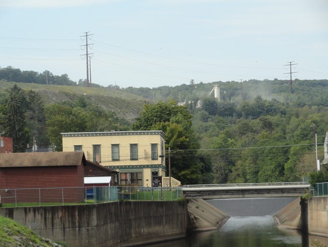 Part of the asphalt plant at Leeward Middle Creek Quarry is visible on the ridge as seen from Hawley Borough. The Middle Creek bridge on Route 6 and the spillway are in view. Acreage on the ridge, to the left, woud be subject to stone quarrying if E.R. Linde Construction (Leeward Construction) is granted approval by the Palmyra Township Zoning Hearing Board. The meeting date, time and location will be announced by the township.