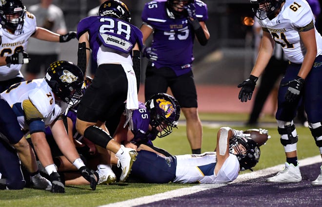 Stephenville running back Tate Maruska is tackled just short of the goal line during Friday's game against Wylie High School at Bulldog Stadium.