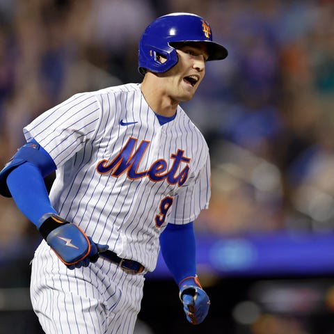 New York Mets' Brandon Nimmo reacts after hitting 