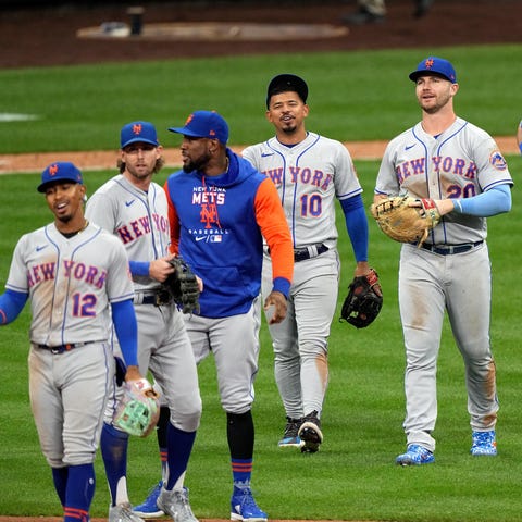 The New York Mets celebrate clinching a playoff be