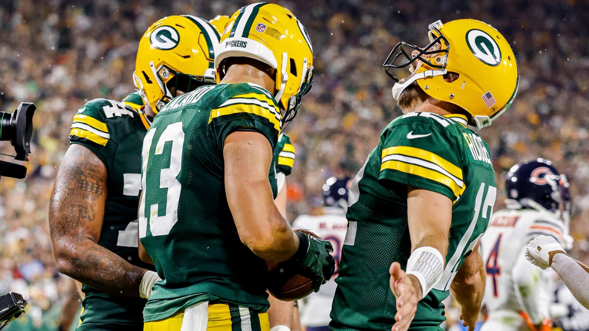 Aaron Rodgers celebrates with teammates after Allen Lazard's touchdown.