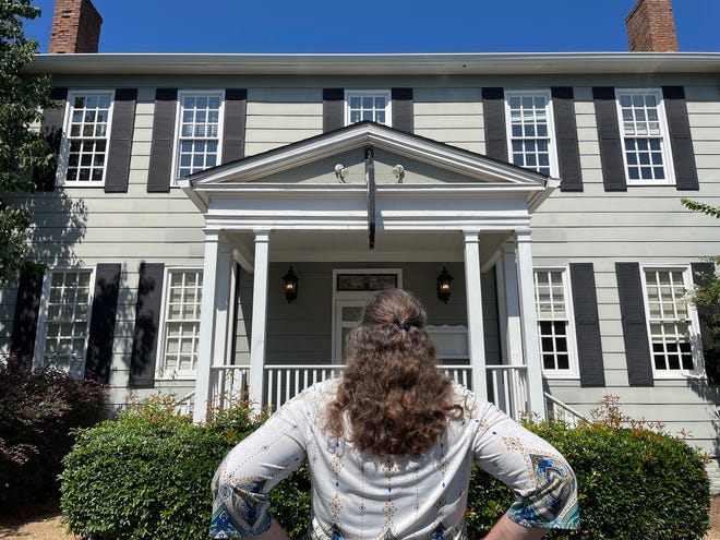 "Ghosts of Athens and Beyond" author Tracy Adkins stands in front of the Hoyt House at the Graduate Athens on Sept. 7, 2022.