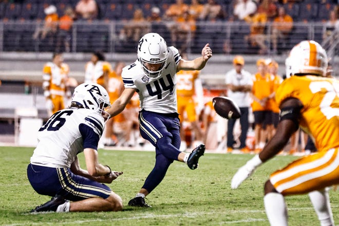 Akron place kicker Noah Perez (44) kicks a field goal as punter Noah Gettman (36) holds during the second half of an NCAA college football game against Tennessee Saturday, Sept. 17, 2022, in Knoxville, Tenn. (AP Photo/Wade Payne)