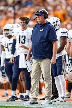 Akron head coach Joe Moorhead watches action during the first half of an NCAA college football game against Tennessee Saturday, Sept. 17, 2022, in Knoxville, Tenn. (AP Photo/Wade Payne)