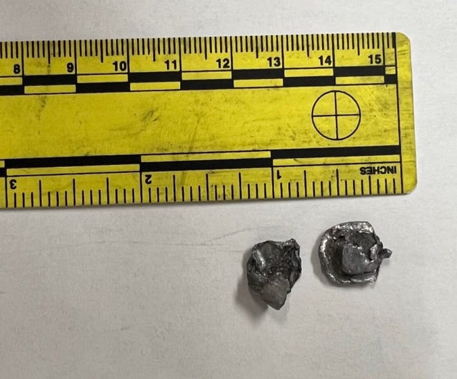 Police recovered these pellets they say were discharged from a shotgun and into a neighbor's house Monday. Michael Anderton, 36, of Kewanee, faces several weapons charges following the incident.
