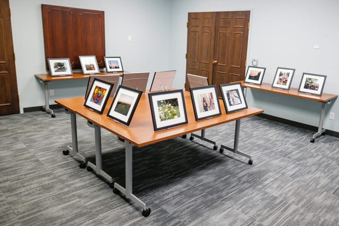 Photographs on display at the opening night of the Adelante Arts Camp exhibition at the Tuskalawa County Public Library in New Philadelphia.