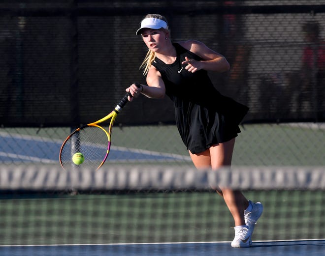 Wylie senior Carly Bontke plays a singles match against a Cooper High opponent Tuesday at Wylie High School.