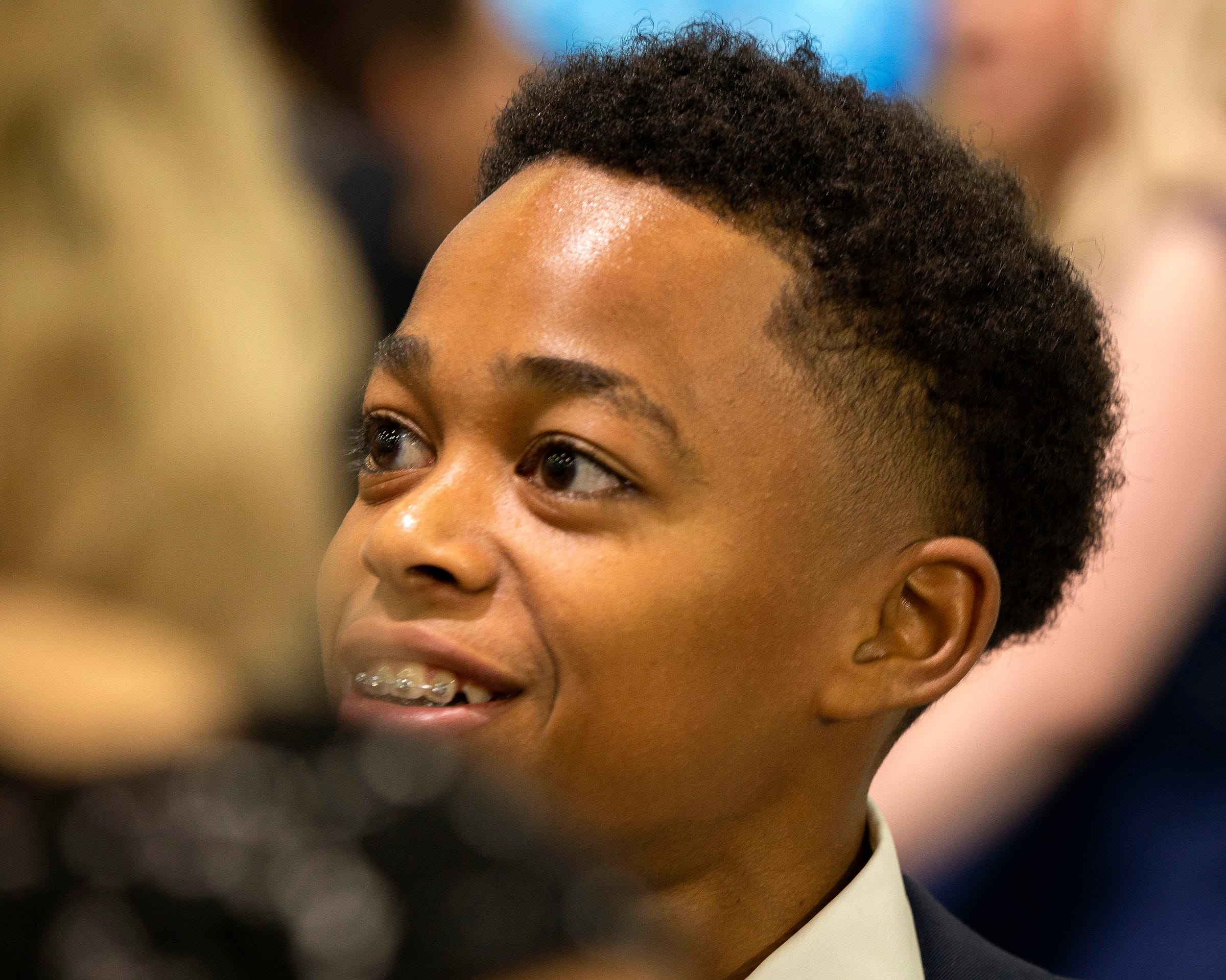 The 13-year-old t-shirt brand talks to people about his shirts on display in the Cadillac area at the 2022 North American International Auto Show charity preview at Huntington Place in Detroit, Friday, Sept. 16. Developer Langston Howard smiles. , 2022. Howard is a member of the Boys and Girls Club, where he networked with other entrepreneurs and business professionals to learn how to improve their business. He also has select pieces of his that will be exhibited at New York Fashion Week.