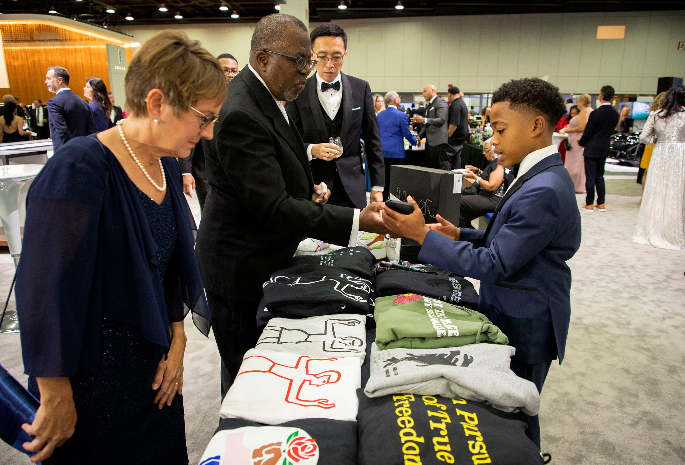 Langston Howard, 13, T-shirt brand developer, talks about his shirt with Detroit's Ron Evans Center in the Cadillac area during the 2022 North American International Auto Show charity preview at Huntington Place, Detroit, Friday, September 9. , right 16/16/2022. Howard belongs to the Boys and Girls Club, where he networked with other entrepreneurs and business professionals to learn how to improve their business. He also has select pieces of his that will be exhibited at New York Fashion Week.