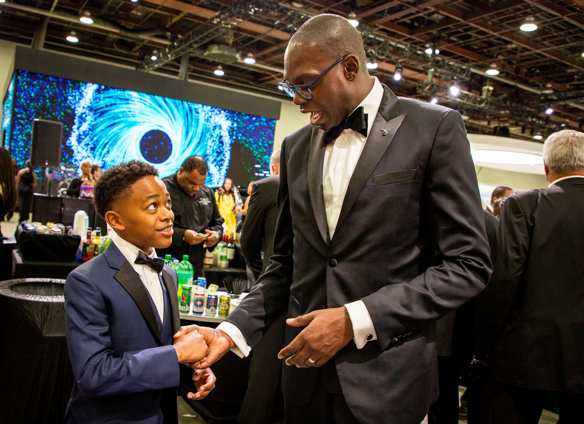 13-year-old T-shirt brand developer Langston Howard (left) meets Michigan Lieutenant Governor Garin Gilchrist at the 2022 North American International Auto Show charity preview at Huntington Place, Detroit, Friday, Sept. 16, 2022. I met She joined the Girls Club and is learning how to network with other entrepreneurs and business professionals so she can grow her business. He also has select pieces of his that will be exhibited at New York Fashion Week.