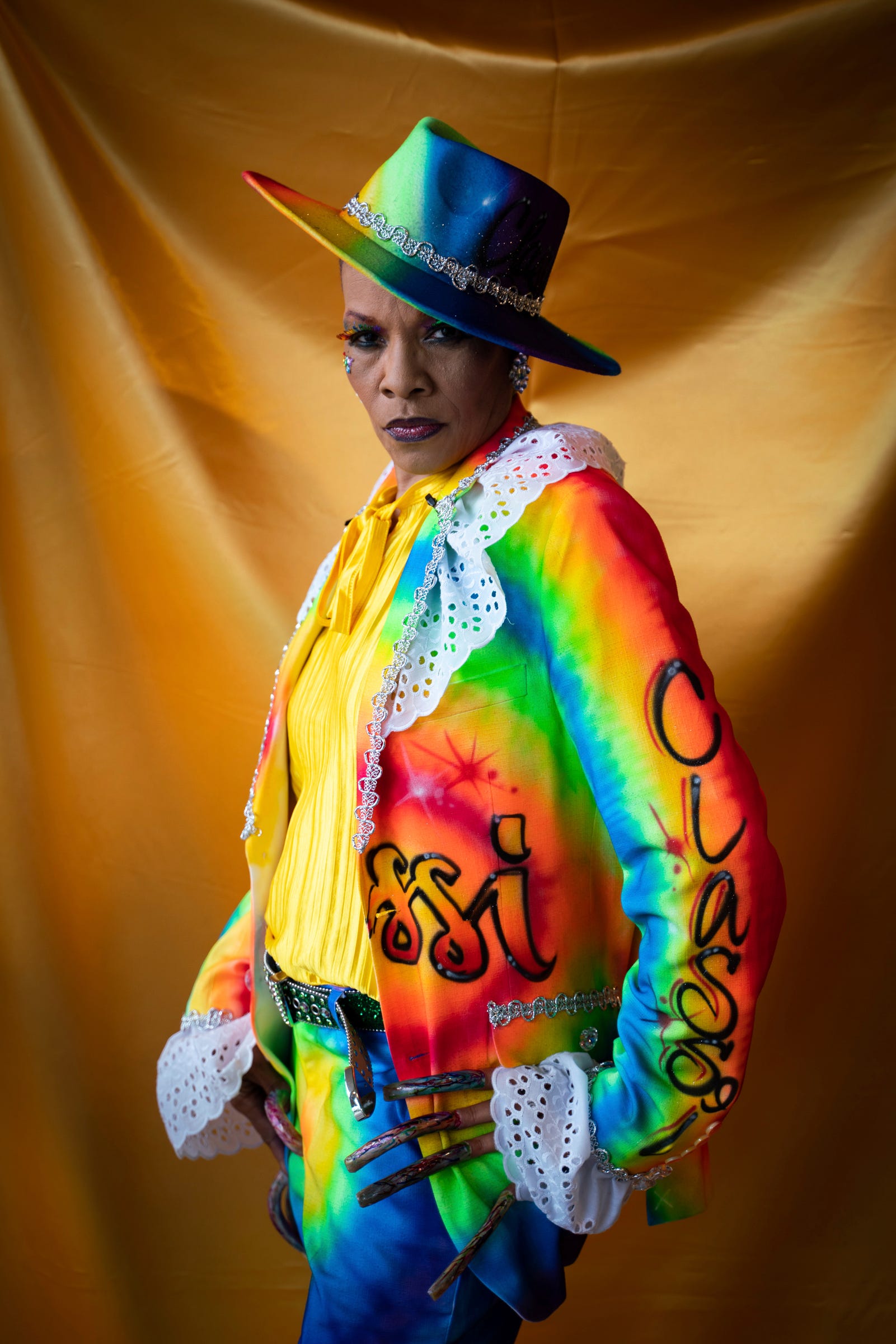 Colors, of Columbus, Ohio, stands for a portrait before the Hair Wars and Hot Cars runway show at Ford Community and Performing Arts Center in Dearborn on Sunday, September 18, 2022. "Anyone connected with hair wars becomes family," said Colors who has been attending for 32 years.