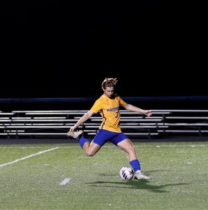 Maysville's Wyatt Mynes scores a penalty kick during a game wit John Glenn in a battle for first place in the Muskingum Valley League. Mynes earned the Big School Division Player and Offensive Player of the Year award.