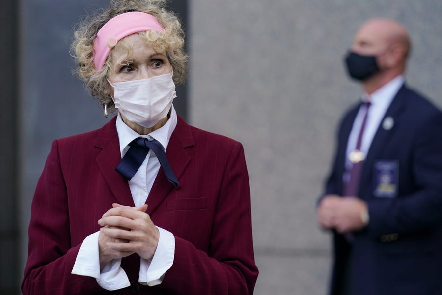 E. Jean Carroll, who says President Donald Trump raped her in the 1990s, leaves the Daniel Patrick Moynihan United States Courthouse following a hearing in her defamation lawsuit against Trump, Wednesday, Oct. 21, 2020, in New York. A federal judge on Tuesday denied President Donald Trump's request that the United States replace him as the defendant in a defamation lawsuit alleging he raped a woman in a Manhattan department store in the 1990s. (AP Photo/John Minchillo)