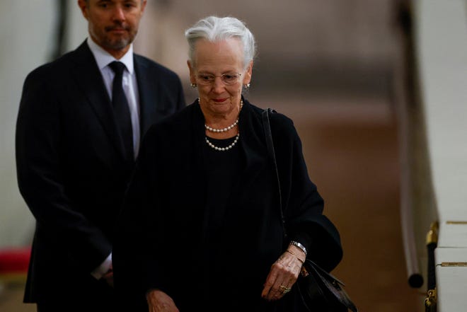 Denmark's Queen Margrethe pays her respect to the coffin of Britain's Queen Elizabeth, following her death, during her lying-in-state at Westminster Hall, in London, Sunday Sept. 18, 2022.