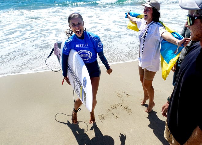 20 September 2022;  Huntington Beach, California, USA;  Anastasia Temirbek of Ukraine celebrates after participating in the run-off of the 2022 ISA World Surfing Games in Huntington Beach, California, as the Ukrainian surfing team attempts to qualify for the 2022 Summer Olympics in Paris, France.